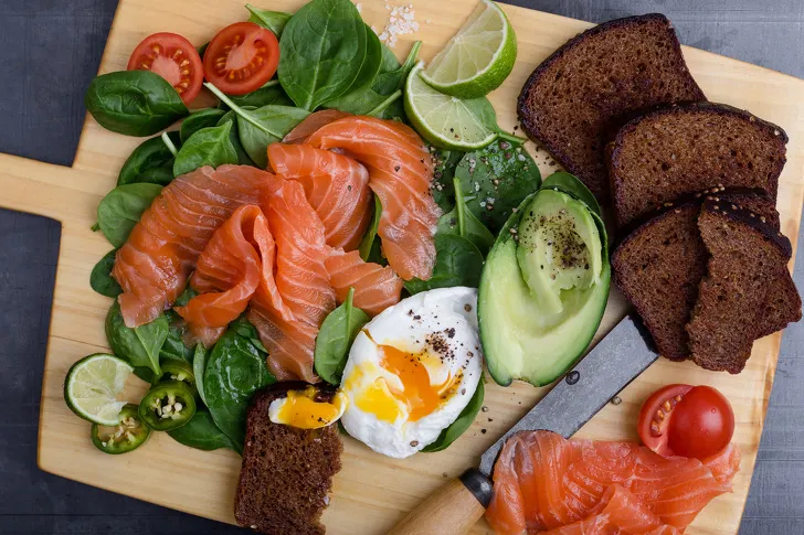 Making delicious salad with salted salmon and fresh vegetables